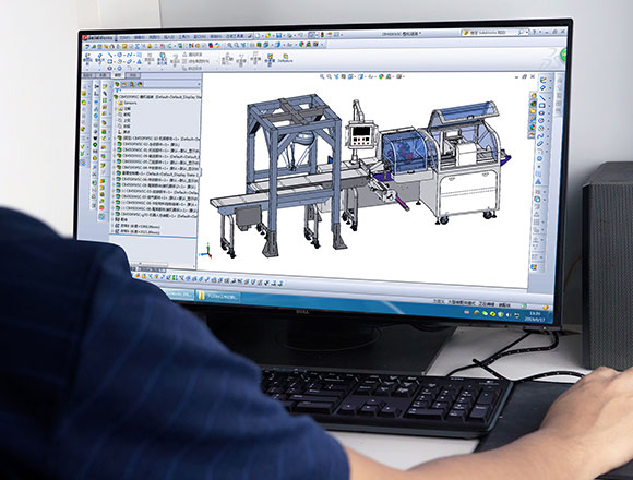 An engineer is designing the packaging machine with a software